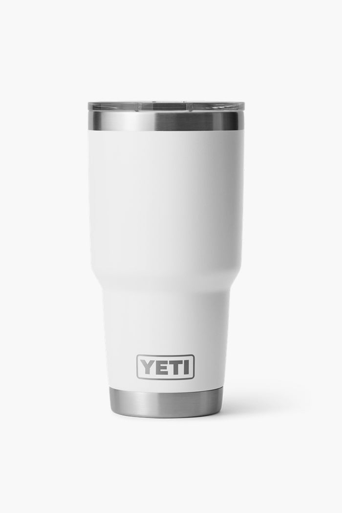 A white 30oz YETI Rambler tumbler with a stainless steel rim and base, featuring the YETI logo and double-wall vacuum insulation to keep drinks at the perfect temperature.
