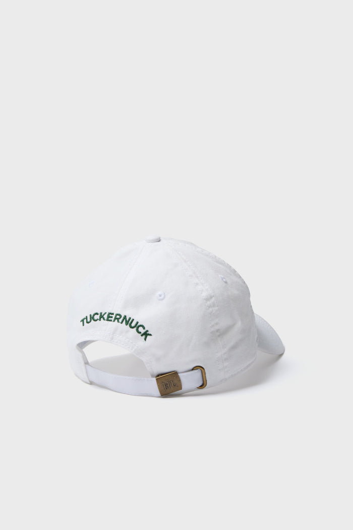 White Tuckernuck Hat with classic green embroidery, effortless adjustable sailcloth strap, and high-end brass buckle. Perfect for a fun, stylish look.