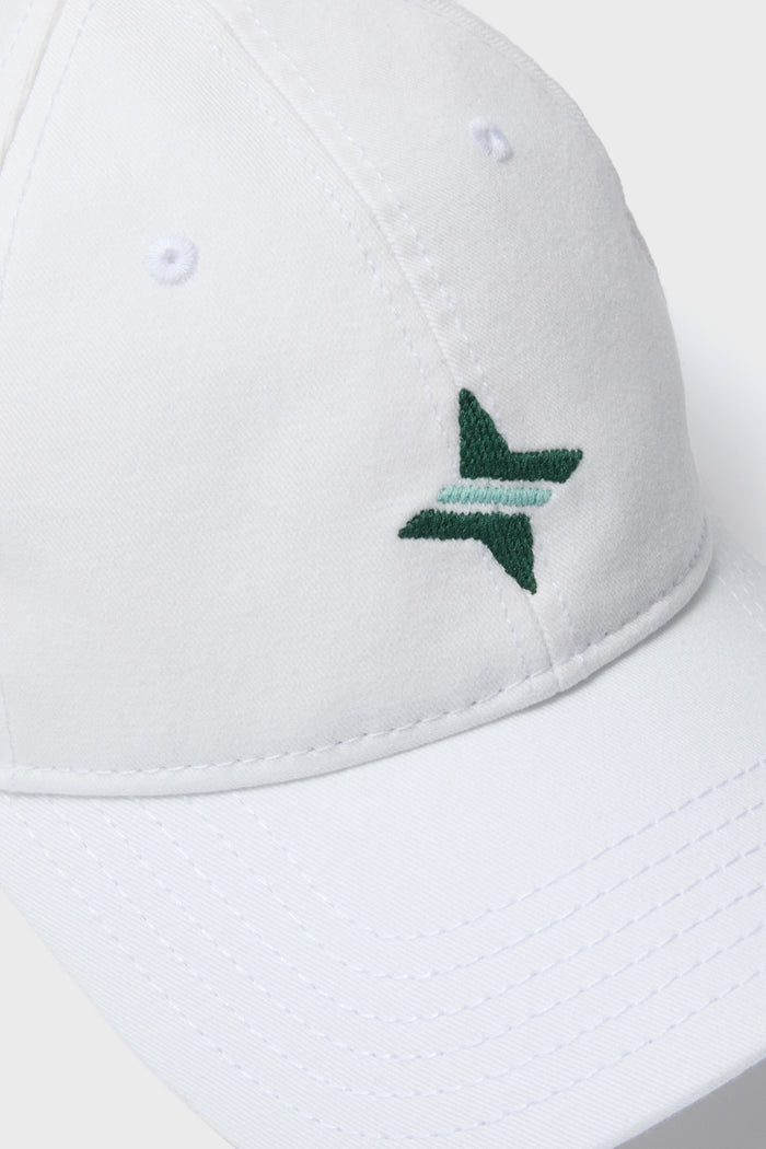 White Tuckernuck Hat: A classic, high-end baseball cap with effortless style, featuring a green embroidered logo, needlepoint stitching, and an adjustable sailcloth strap.