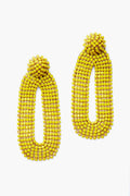 A pair of oval-shaped yellow Bianca statement earrings by Deepa Gurnani, featuring handmade yellow beading and rounded tops.