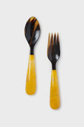 These unique Lily Juliet salad servers feature dark brown tops and yellow marbled handles, placed side by side.