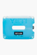 A blue rectangular YETI ICE pack with a central handle and label showing 4 lbs keeps contents at -2°C, making it an ideal YETI cooler accessory for optimal ice retention.
