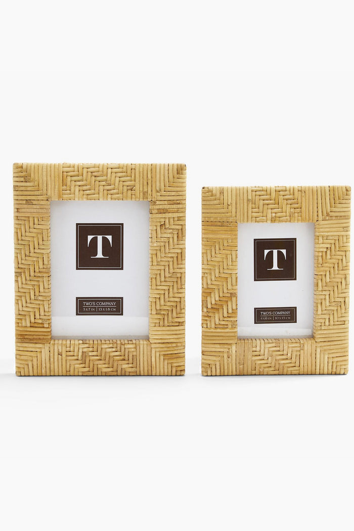 Twos Company rectangular Woven Rattan Picture Frames feature a light woven pattern and display mock photos with a T logo. These stylish frames add a boho vibe to any space and make an ideal housewarming gift.
