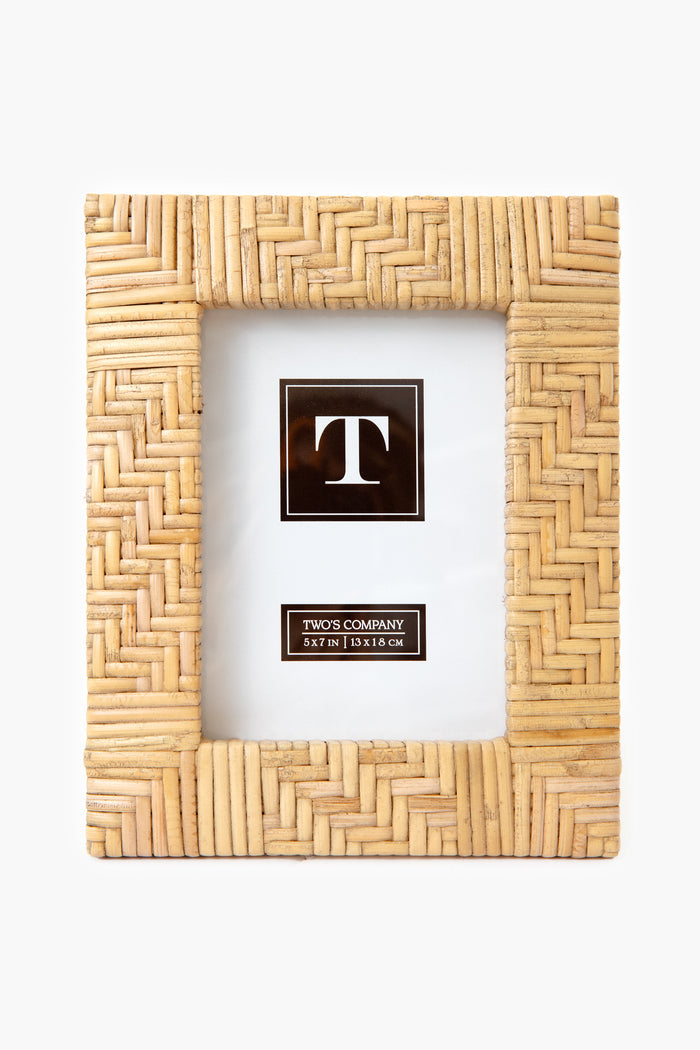 The Two's Company Rectangular Woven Rattan Picture Frame features a bamboo pattern and a placeholder insert with the letter T and size. Perfect for boho home décor or as an ideal housewarming gift.