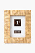 The Two's Company Rectangular Woven Rattan Picture Frame features a bamboo pattern and a placeholder insert with the letter T and size. Perfect for boho home décor or as an ideal housewarming gift.
